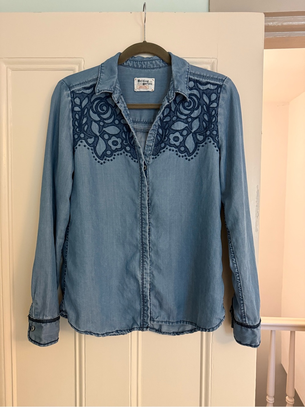 HOLDING HORSES Light Denim Button-Down Shirt with Navy Embroidery.